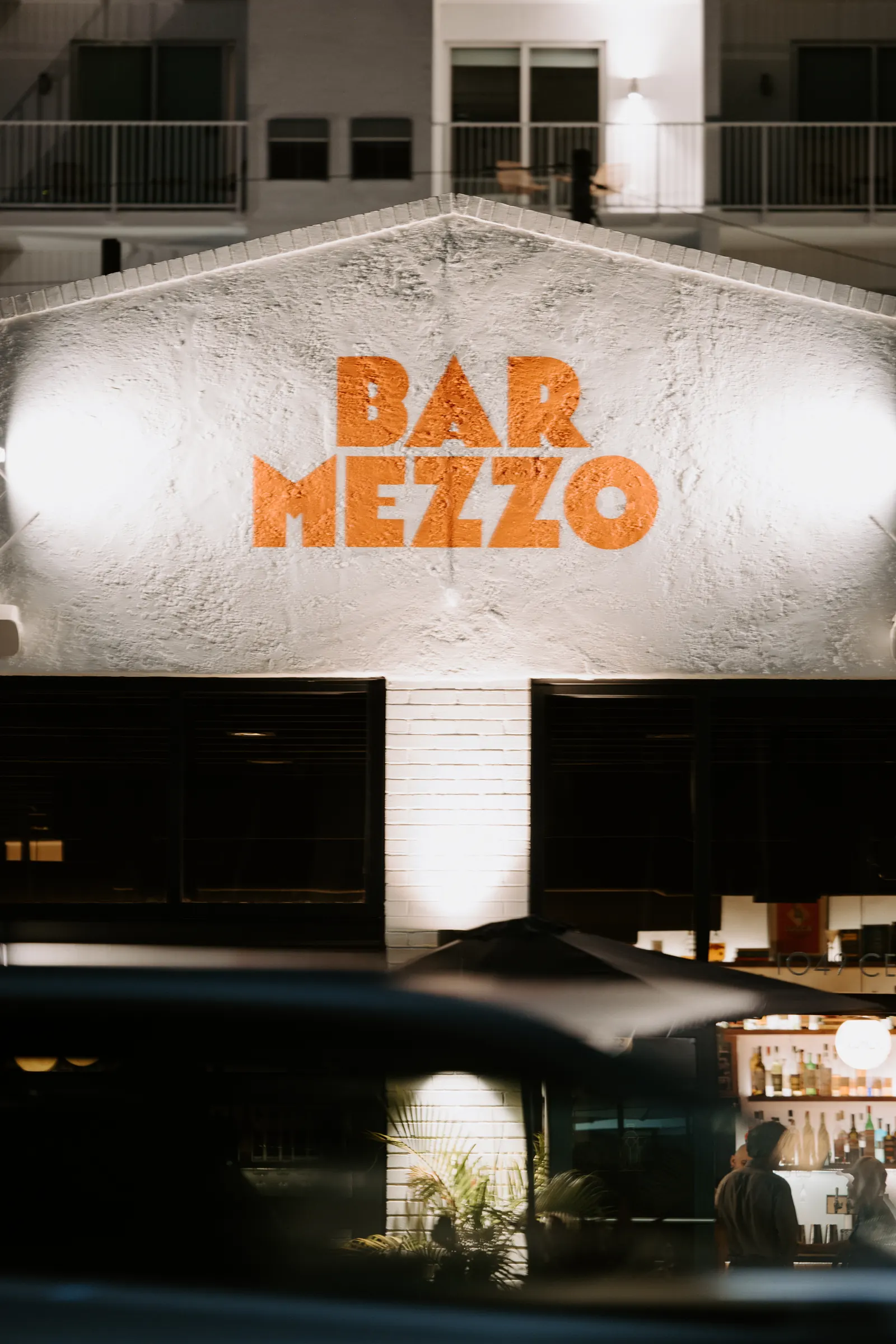 Bar Mezzo sign glowing at night in St. Petersburg, FL, shot with a 70-200mm lens