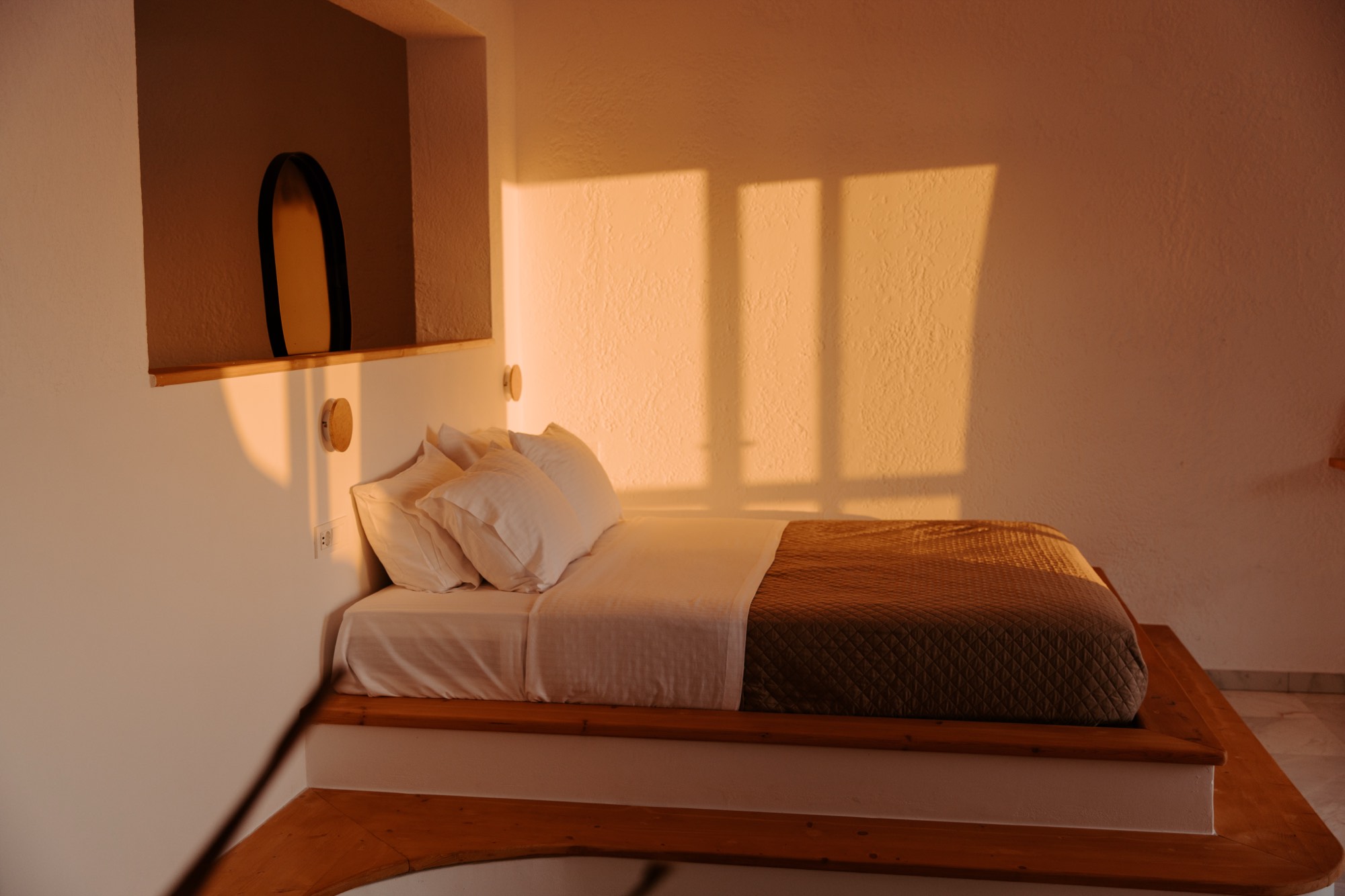 Bright boutique hotel guest room with white linens — hotel room photography by Orange Grove Social