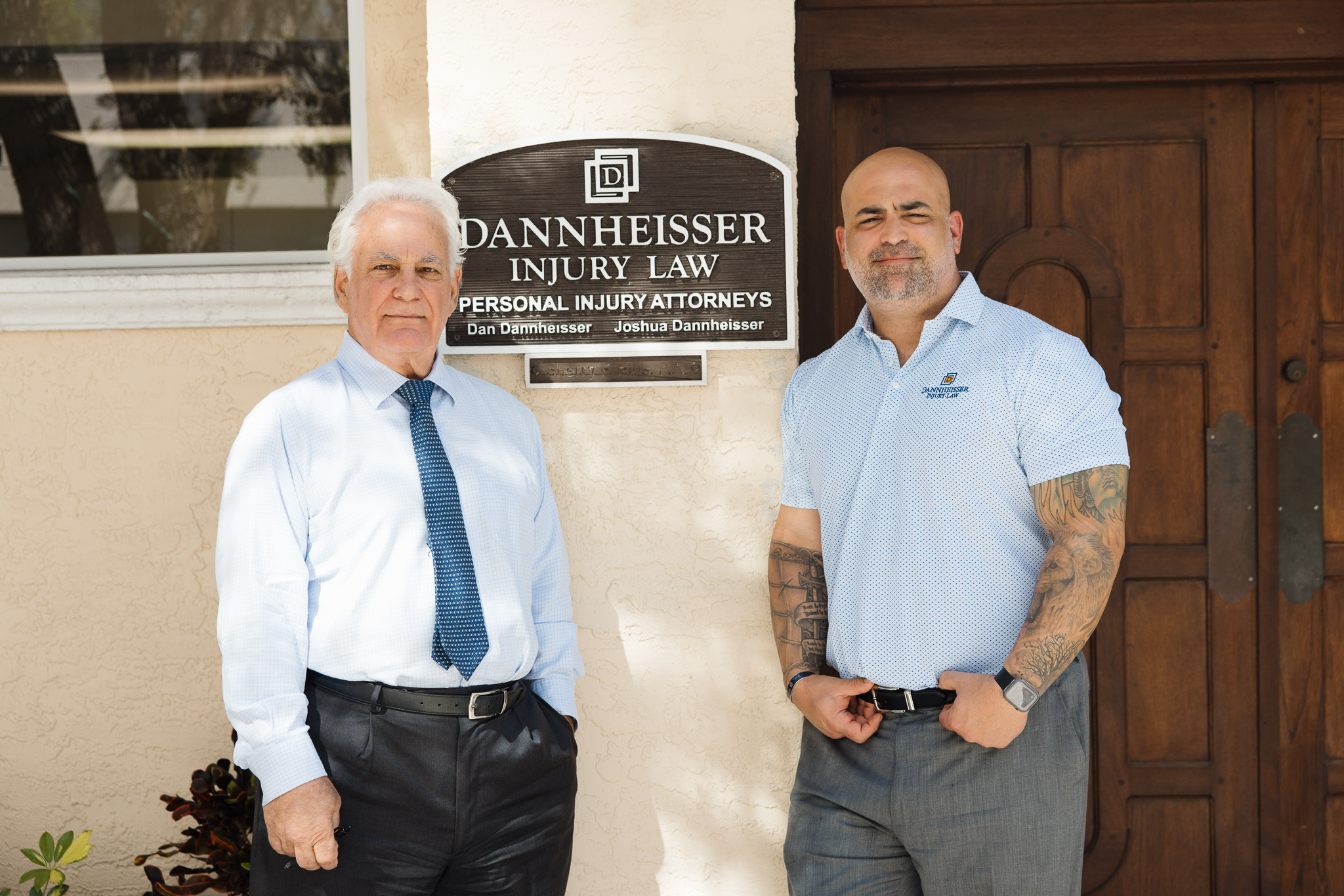 Dannheisser Injury Law personal injury attorneys outside their Sarasota FL office — service business brand photography by Orange Grove Social