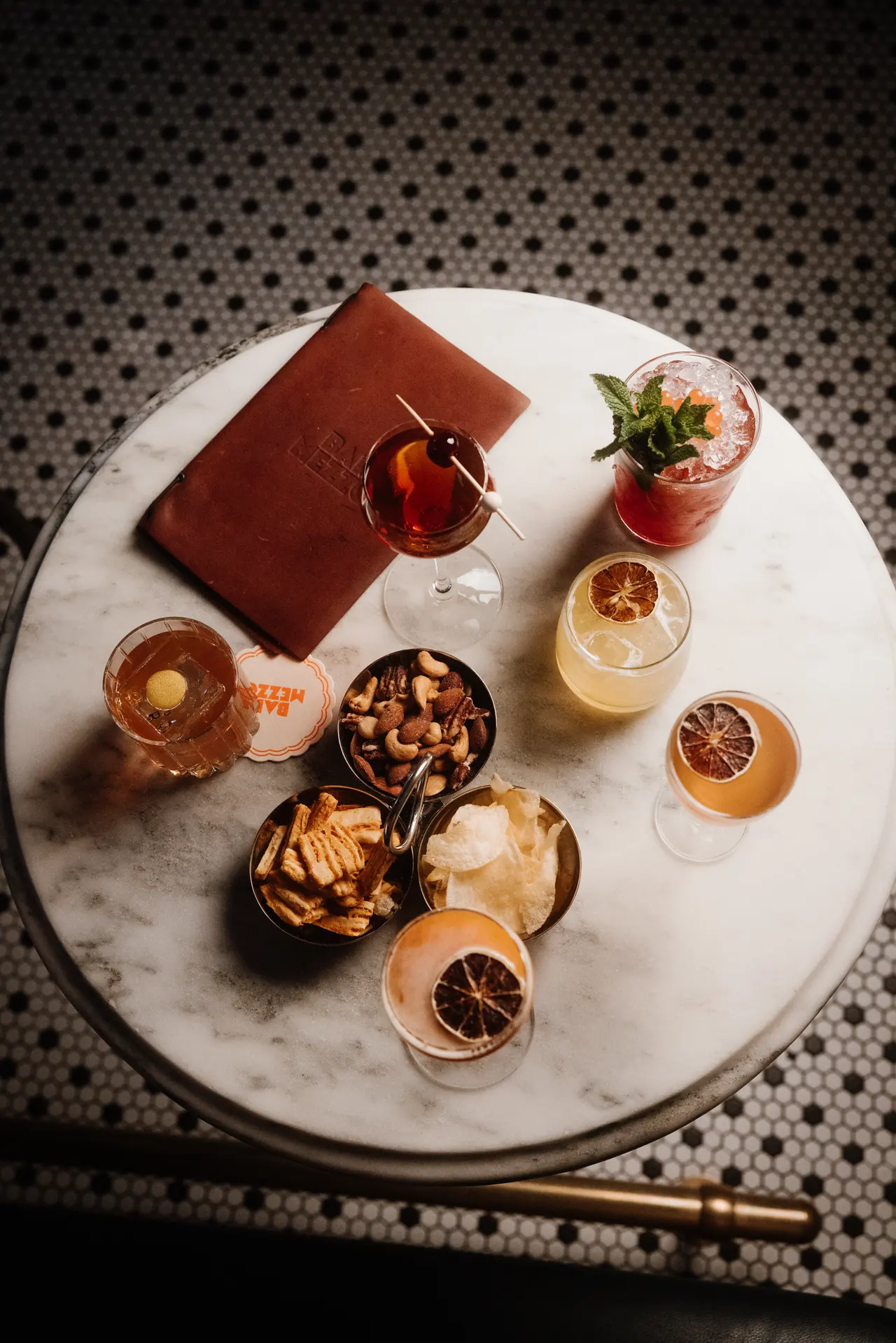 Overhead of cocktails and bar snacks at Bar Mezzo, photographed by Orange Grove Social