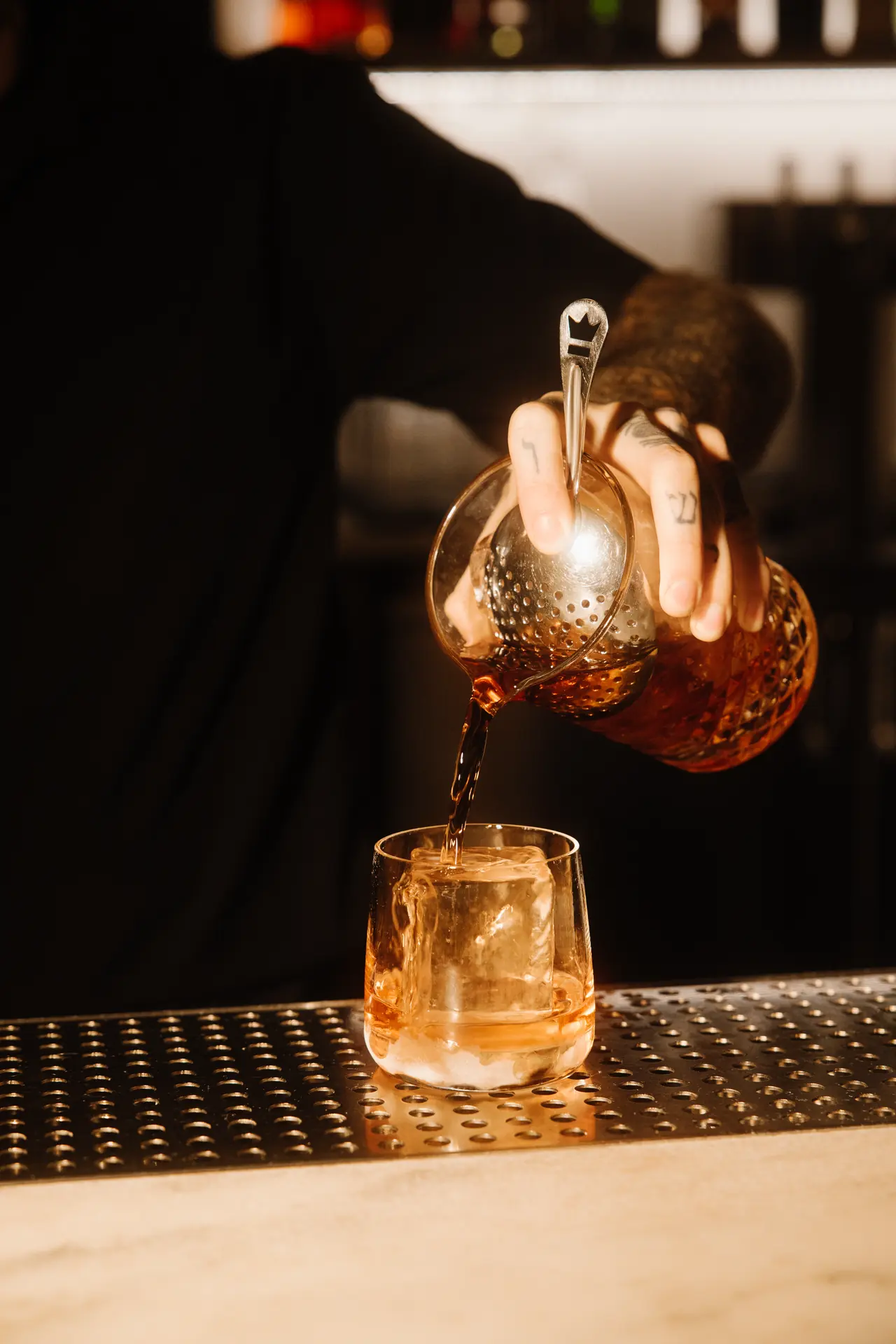 Stirred cocktail poured over ice at Bar Mezzo, photographed by Orange Grove Social