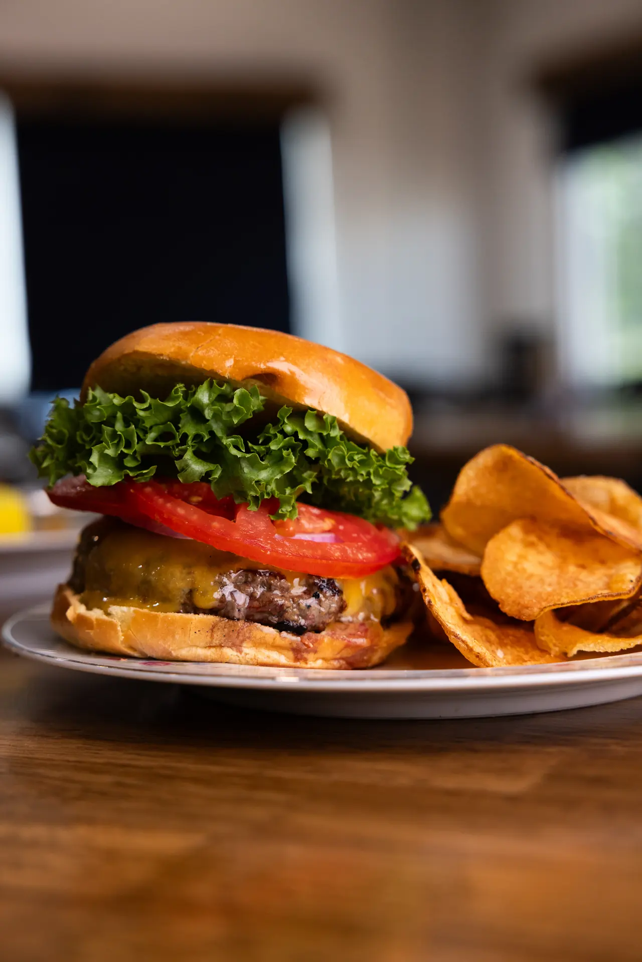 Cheeseburger and house chips at The Tides Market, photographed by Orange Grove Social