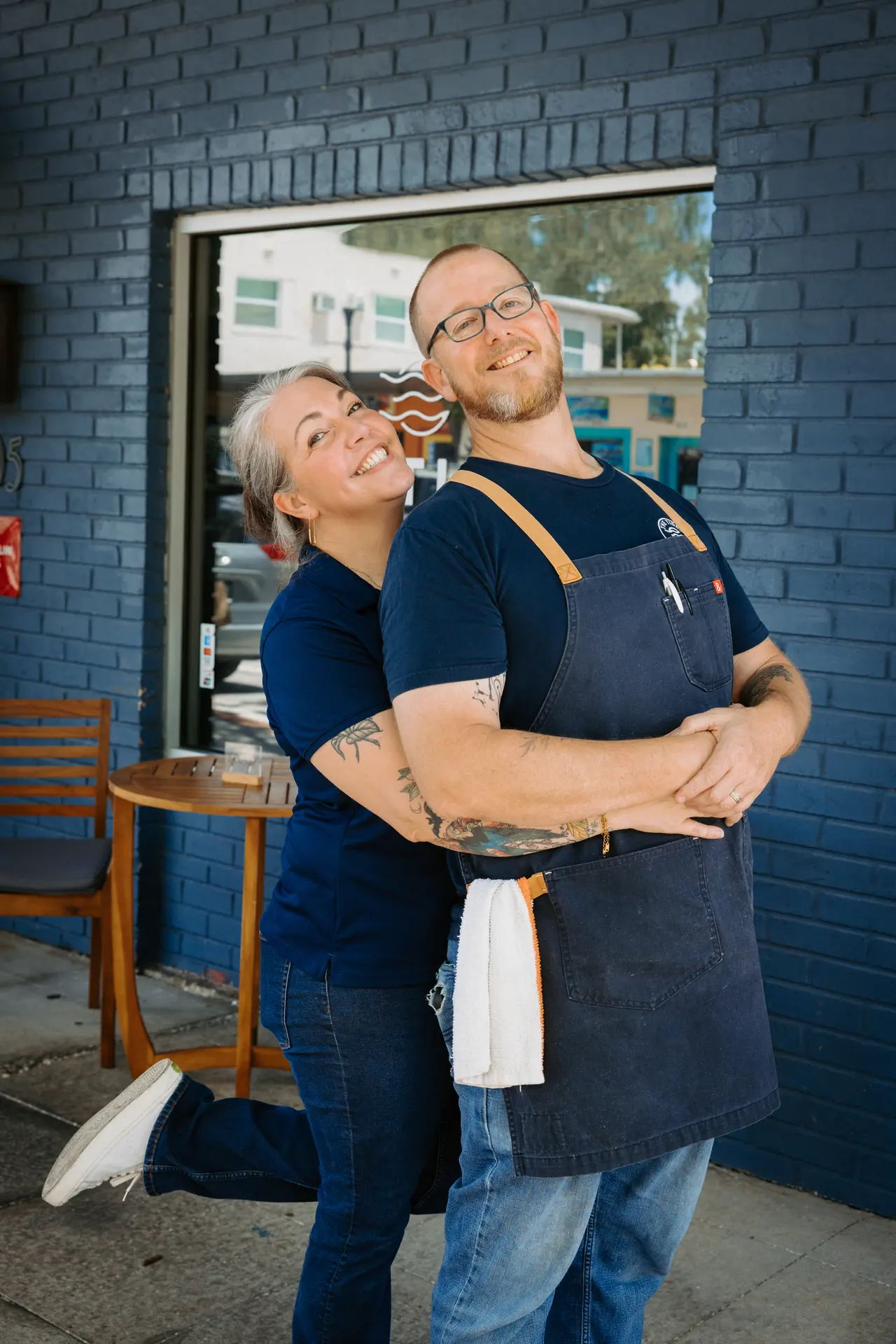 The Tides Market owners outside their Safety Harbor restaurant, photographed by Orange Grove Social