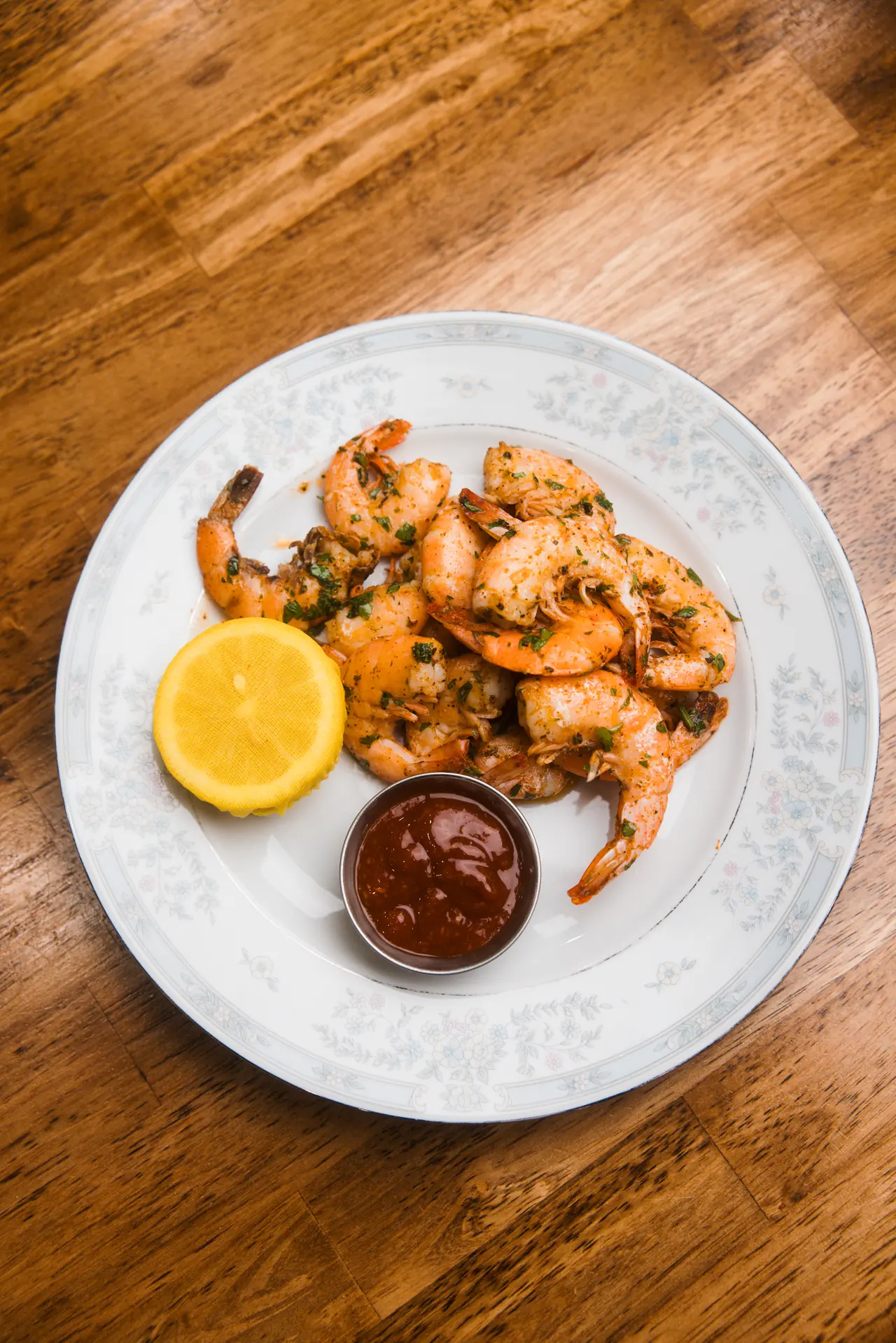 Peel-and-eat shrimp with cocktail sauce at The Tides Market, photographed by Orange Grove Social