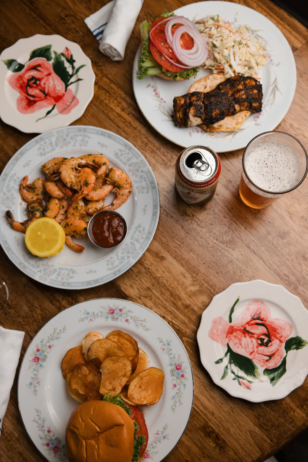 Overhead seafood dinner table at The Tides Market, photographed by Orange Grove Social