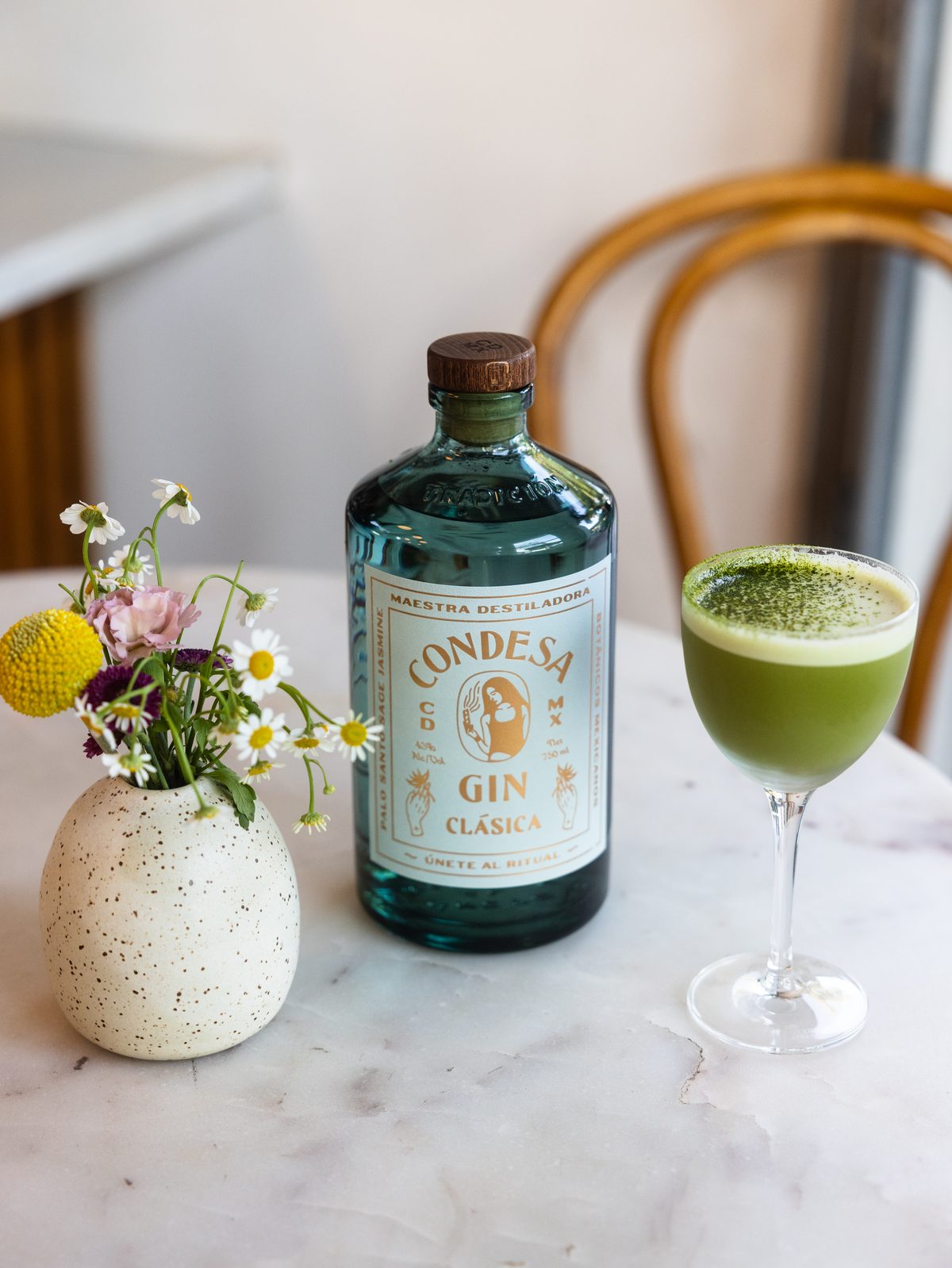 Condesa gin bottle and matcha cocktail on marble at Intermezzo, St. Petersburg FL — bar photography by Orange Grove Social