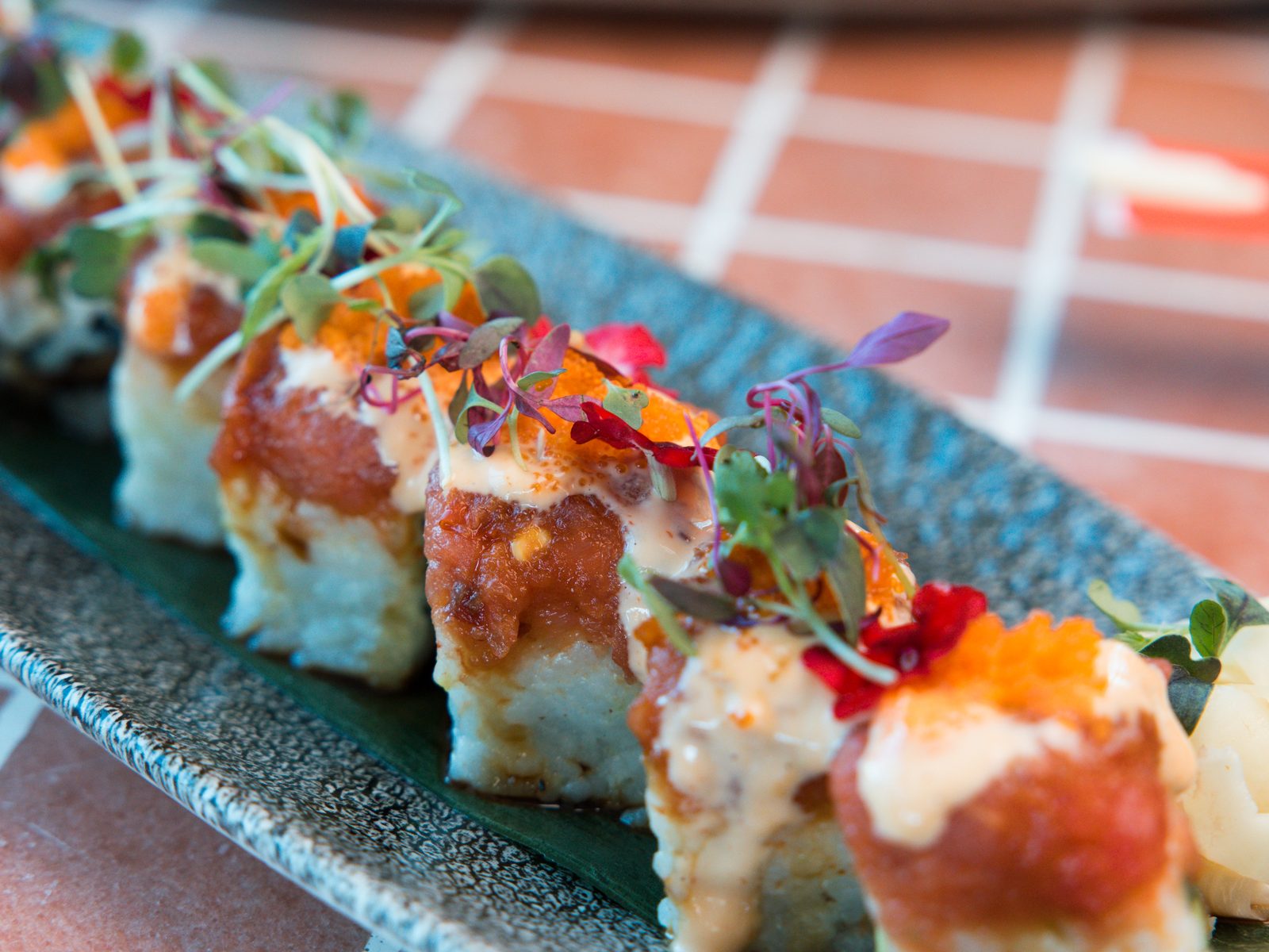 Sushi platter with microgreens at The Moxy Hotel Tampa — restaurant photography by Orange Grove Social