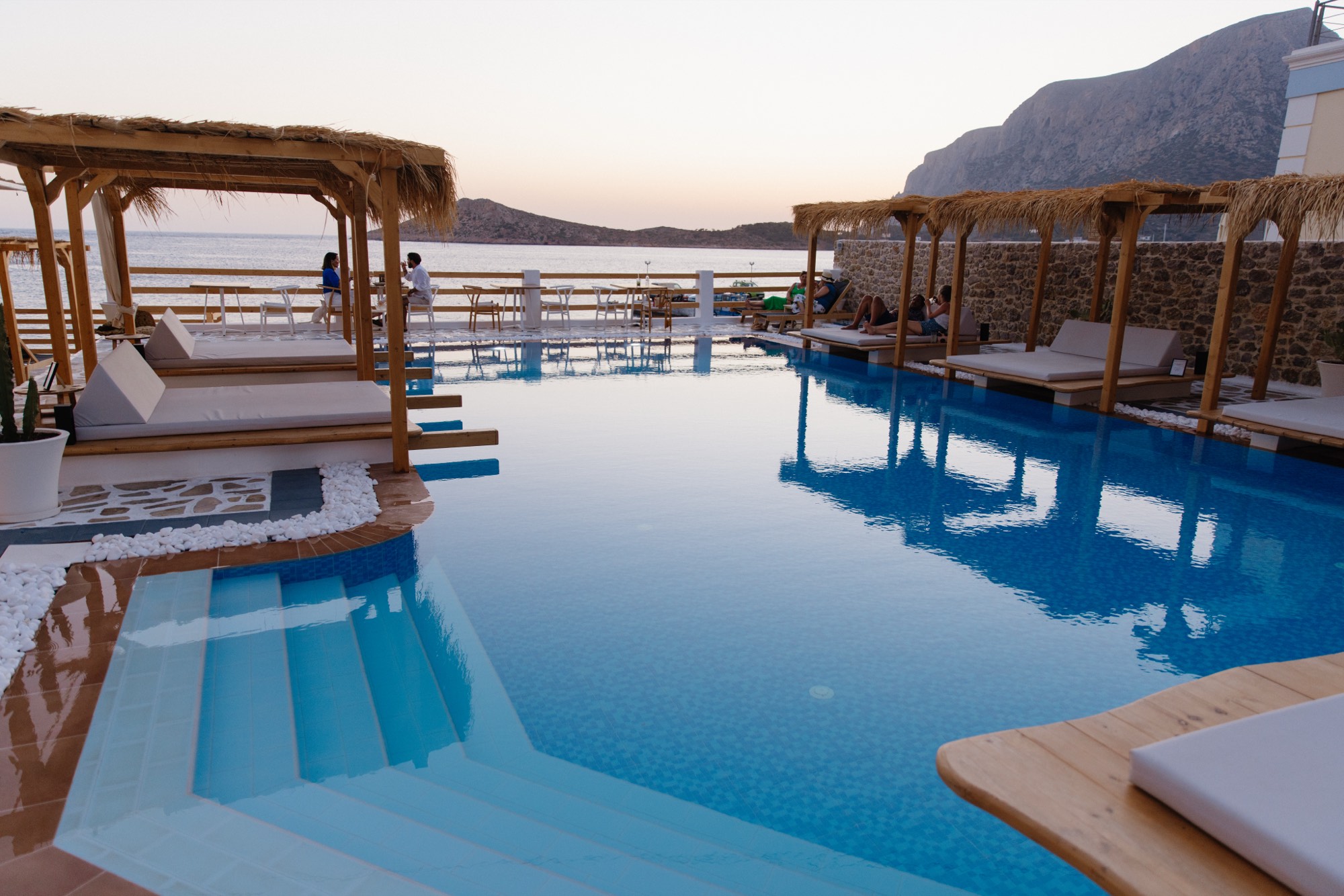 Resort infinity pool at sunset overlooking the sea — hotel photography by Orange Grove Social